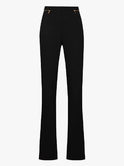 Shop Versace Zipped Flared Wool Trousers In Black