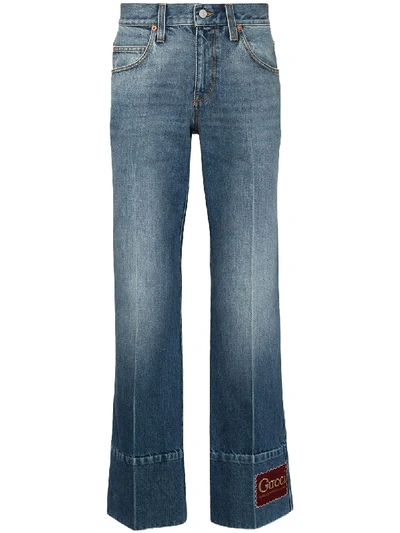 Shop Gucci Logo Patch Flared Jeans In Blue