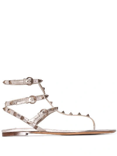 Shop Valentino Rockstud Flat Sandals In Metallisch