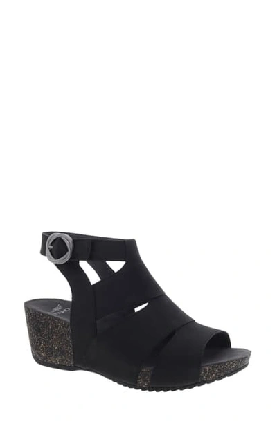 Shop Dansko Sera Wedge Sandal In Black Nubuck Leather