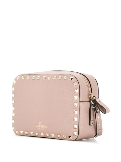 Shop Valentino Rockstud Leather Crossbody Bag In Pink