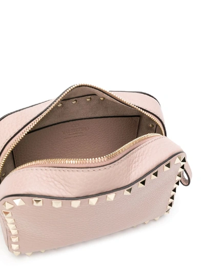 Shop Valentino Rockstud Leather Crossbody Bag In Pink