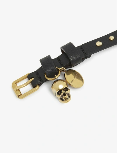 Shop Alexander Mcqueen Leather And Brass Skull Wrap Bracelet In Black