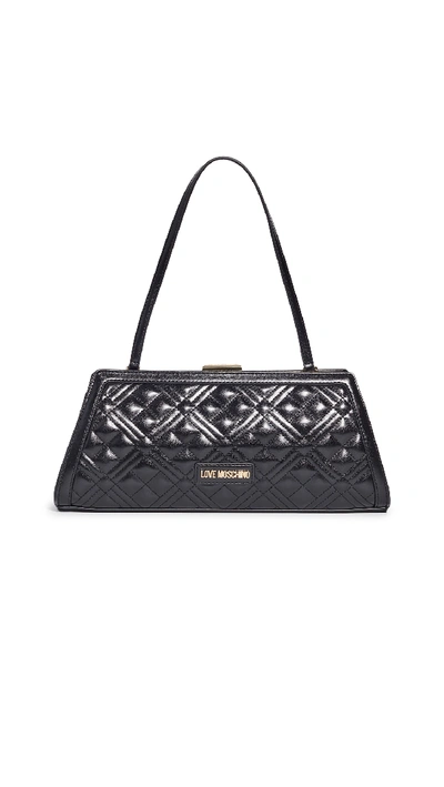 Shop Moschino Quilted Clutch In Black