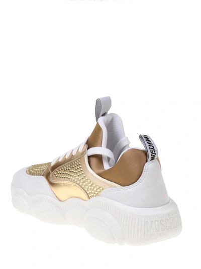 Shop Moschino Women's Gold Leather Sneakers