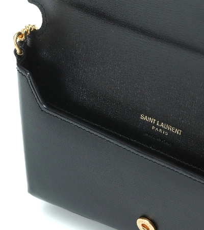 Shop Saint Laurent Cassandre Leather Phone Pouch In Noir