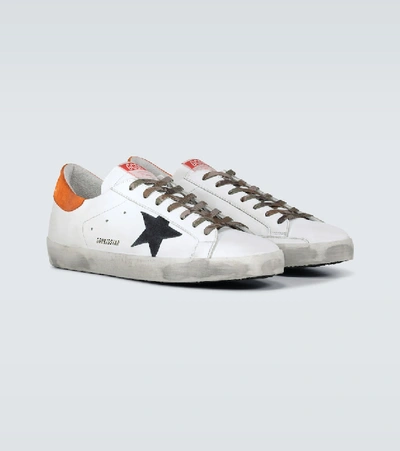 Shop Golden Goose Distressed Superstar Sneakers In White