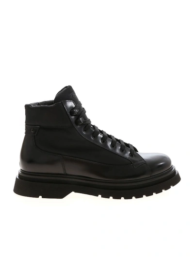 Shop Prada Leather Ankle Boots In Black Featuring Logo