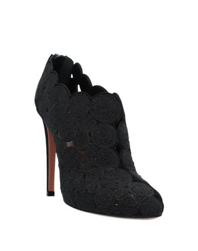 Shop Alaïa Ankle Boot In Black