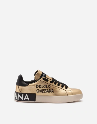 Shop Dolce & Gabbana Foiled Calfskin Portofino Sneakers With Lettering In Gold