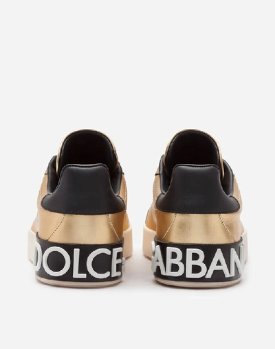 Shop Dolce & Gabbana Foiled Calfskin Portofino Sneakers With Lettering In Gold