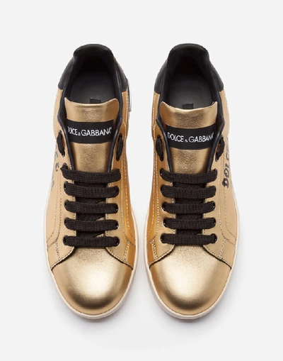 Shop Dolce & Gabbana Foiled Calfskin Portofino Sneakers With Lettering In Gold