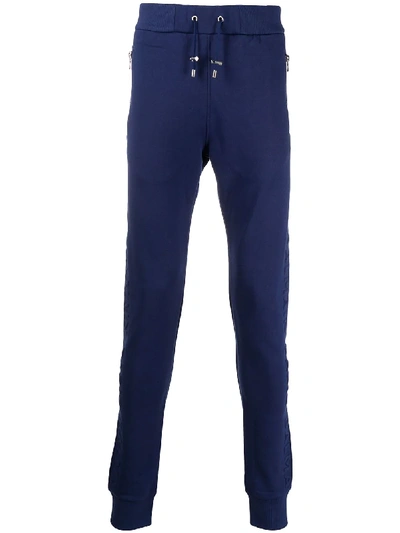 Shop Balmain Embossed Logo Track Pants In Blue