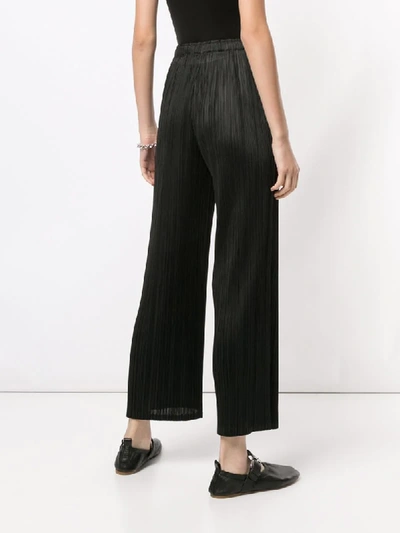 Shop Issey Miyake Pleated Wide-leg Trousers In Black