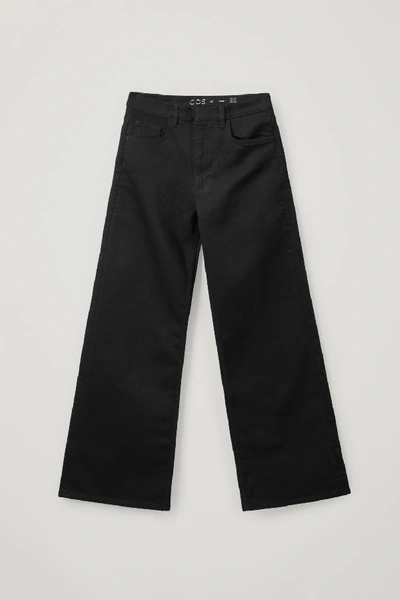 Shop Cos Organic Cotton Flared Jeans In Black