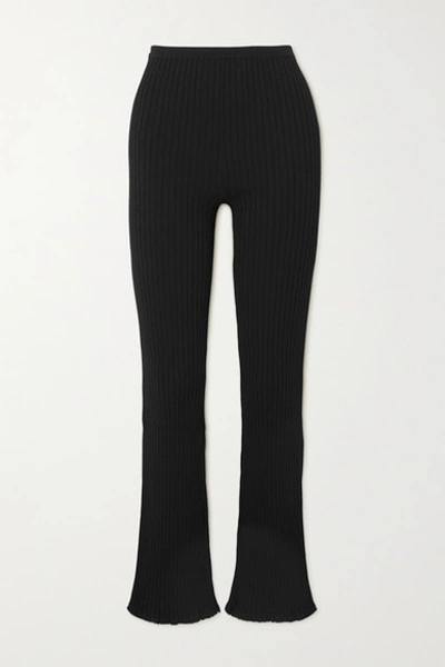 Shop Totême Ry Ribbed-knit Flared Pants In Black