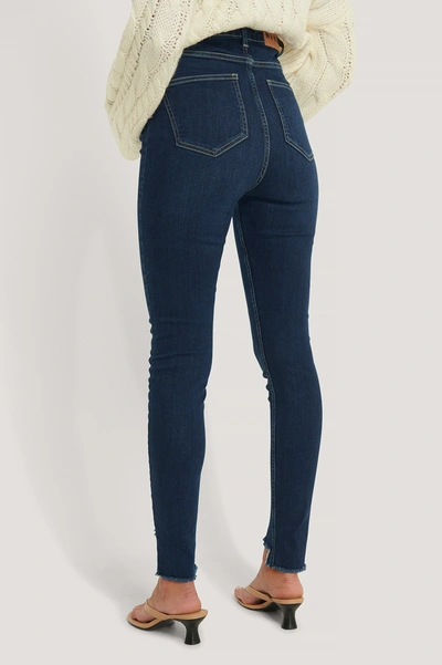 Shop Na-kd Reborn Super High Waist Asymmetrical Hem Jeans - Blue In Dark Blue