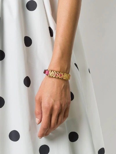 Shop Moschino Adjustable Logo Plaque Bracelet In Pink