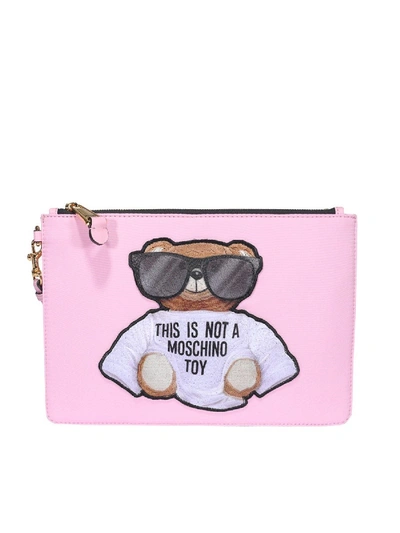 Shop Moschino Teddy Leather Clutch In Pink