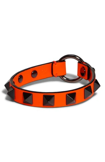 Shop Valentino Studded Neon Leather Bracelet In Orange Fluo