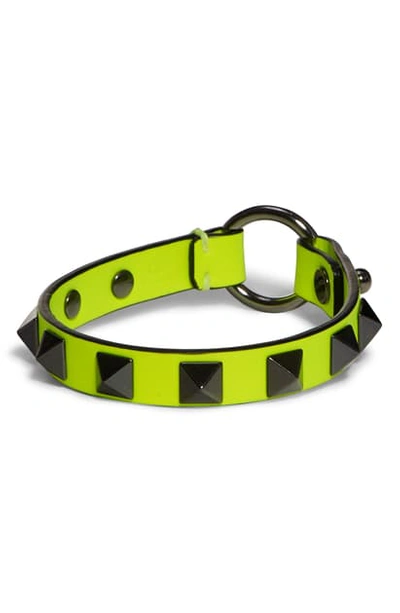 Shop Valentino Studded Neon Leather Bracelet In Yellow Fluo