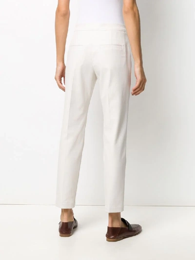 Shop Brunello Cucinelli Embellished Belt Tapered Trousers In Neutrals