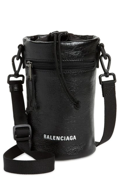 Shop Balenciaga Weekend Leather Bottle Holder In Black