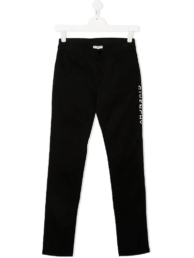 Shop Givenchy Teen Logo Print Trousers In Black