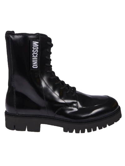 Shop Moschino Side Zipped Logo Boots In Black