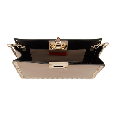 Shop Valentino Pink  Garavani Small Rockstud Clutch Bag In P45 Powder