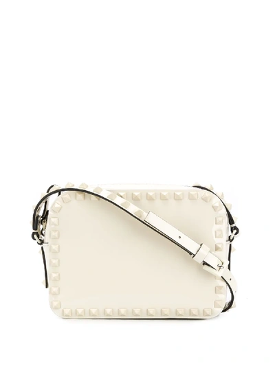 Shop Valentino Small Rockstud Crossbody Bag In Neutrals