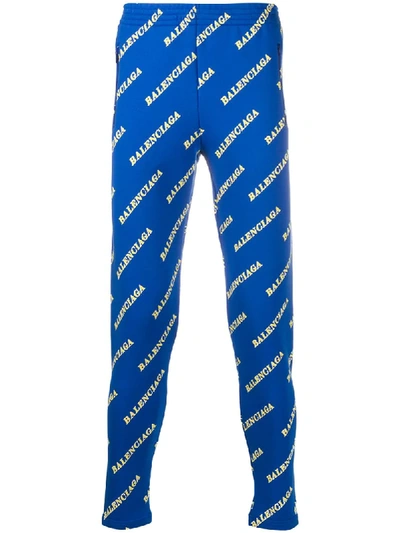 Shop Balenciaga All-over Logo Slim Track Pants In Blue