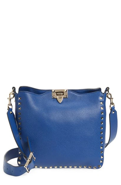 Shop Valentino Small Rockstud Leather Hobo In Blu Delft