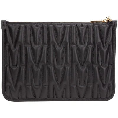 Shop Moschino Quilted Logo Plaque Clutch In Black