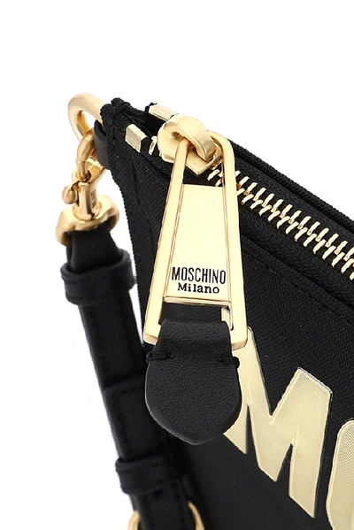 Shop Moschino Couture Logo Clutch Bag In Black