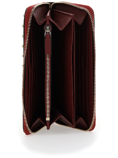Shop Valentino Garavani Rockstud Zip Around Wallet In Red