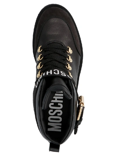 Shop Moschino Logo Strap Combat Boots In Black