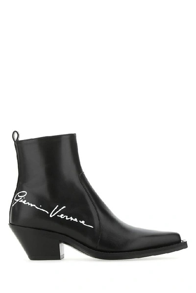 Shop Versace Gv Signature Cowboy Boots In Black