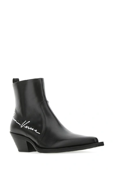 Shop Versace Gv Signature Cowboy Boots In Black