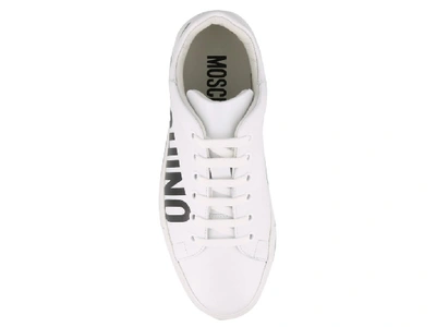 Shop Moschino Logo Print Sneakers In White