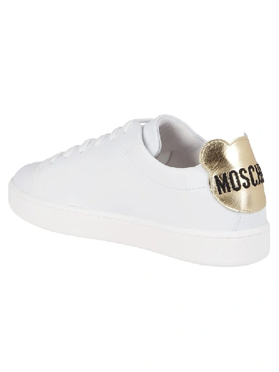 Shop Moschino Teddy Logo Sneakers In White