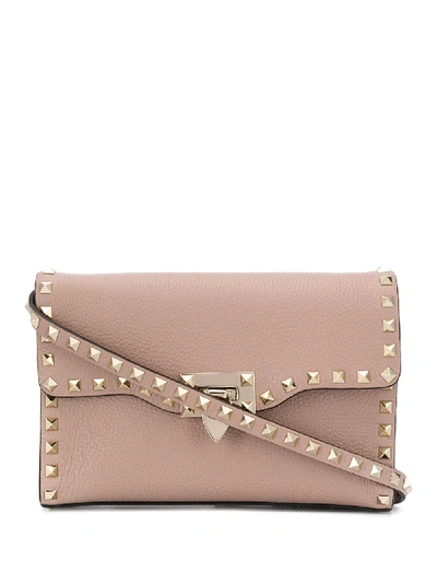Shop Valentino Small Rockstud Leather Crossbody Bag In Pink