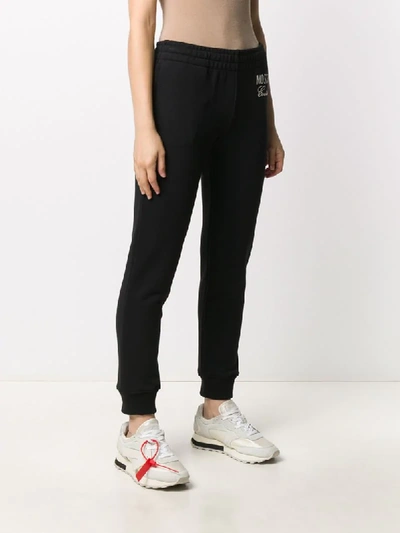 Shop Moschino Couture Print Track Pants In Black