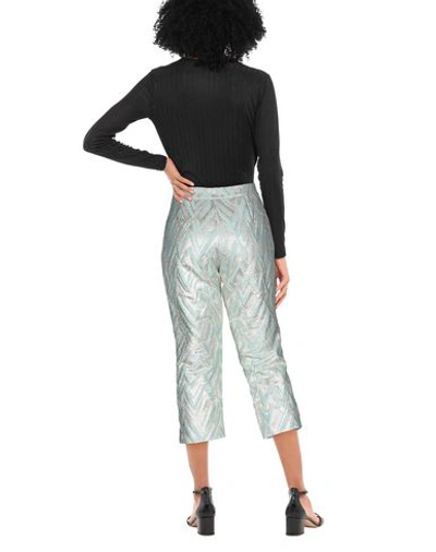 Shop Moschino Cropped Pants In Light Green