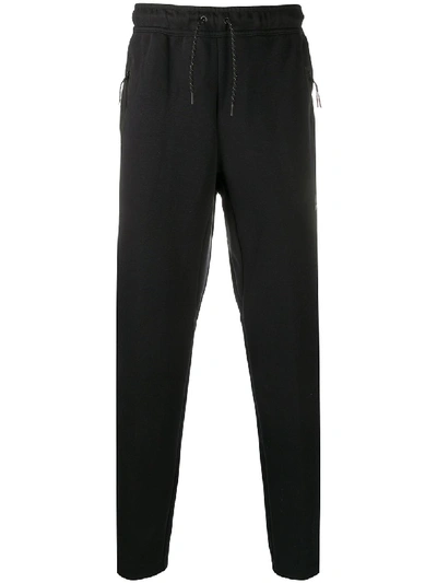 Shop Nike Tapered Track Trousers In Black