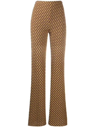 Shop Beaufille Riva Flared Trousers In Yellow