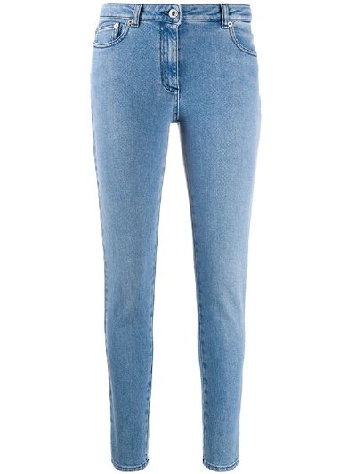 Shop Moschino Skinny Jeans In Blue