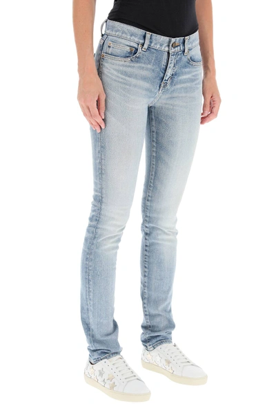 Shop Saint Laurent Low-rise Jeans In Light Blue