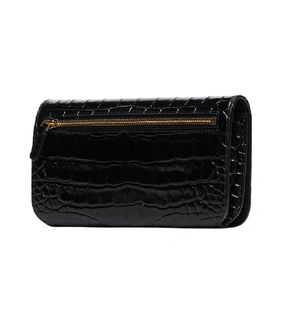 Shop Balenciaga Embossed Crossbody Phone Holder In Black