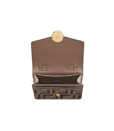 Shop Fendi Ff Monogram Mini Bag In Brown